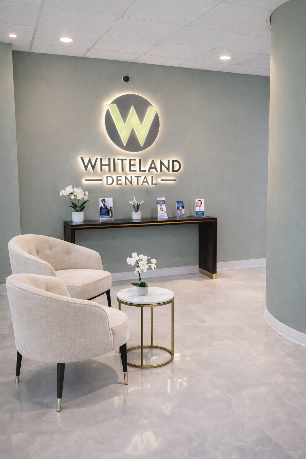 Welcoming front desk and signature logo wall at Wilmington Dental, the premier family and cosmetic dentist in Wilmington, DE